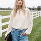 Winter White Swiss Dot Blouse with Peplum Hem - Woman Wearing Ruffle Tie Neck Blouse - Suzy Shier