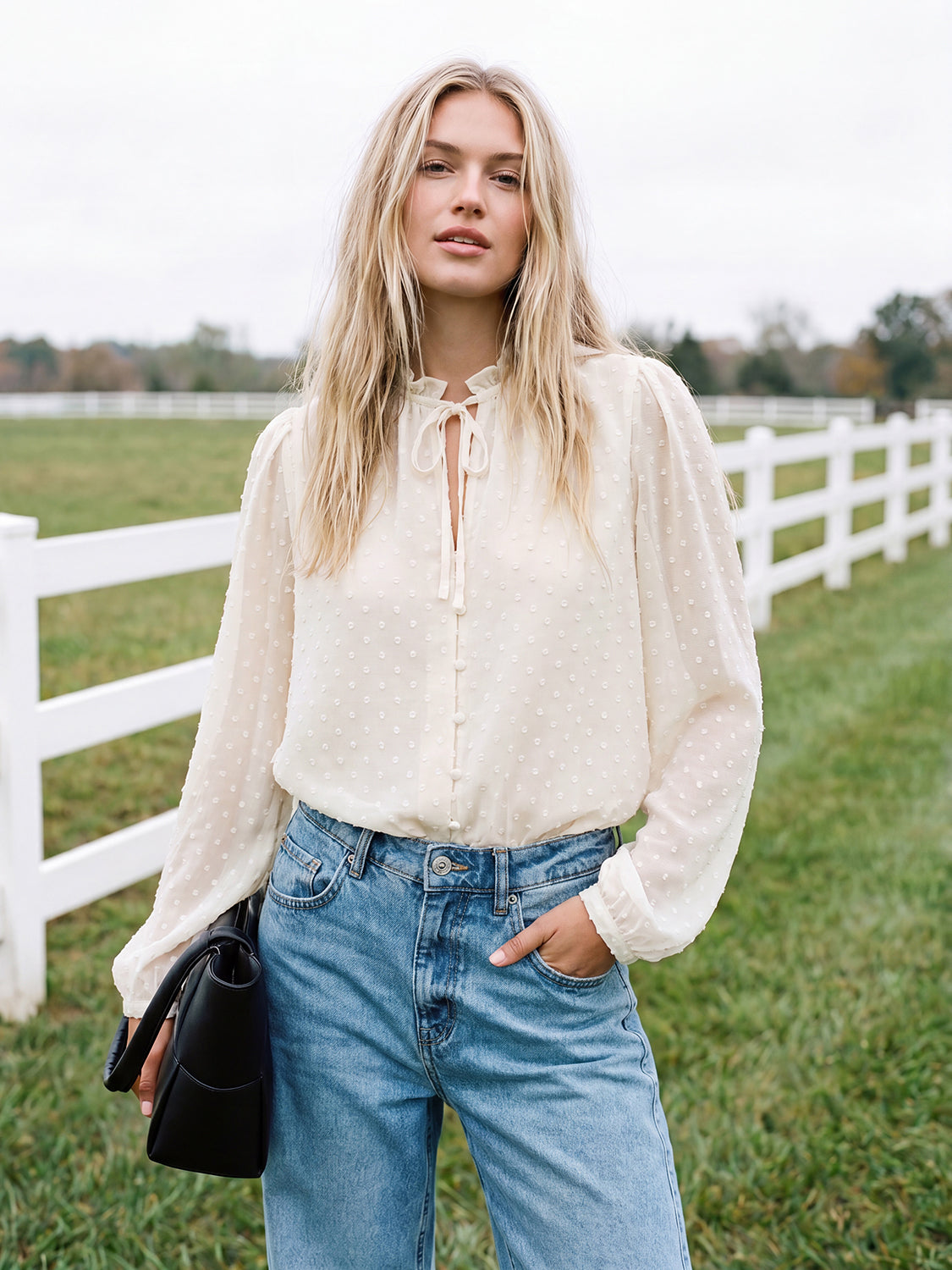 Winter White Swiss Dot Blouse with Peplum Hem - Woman Wearing Ruffle Tie Neck Blouse - Suzy Shier