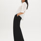Button-front blouse in snow white with tie cuffs and pleated sleeves by Suzy Shier.