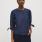 Button-front blouse in snow white with tie cuffs and pleated sleeves by Suzy Shier.