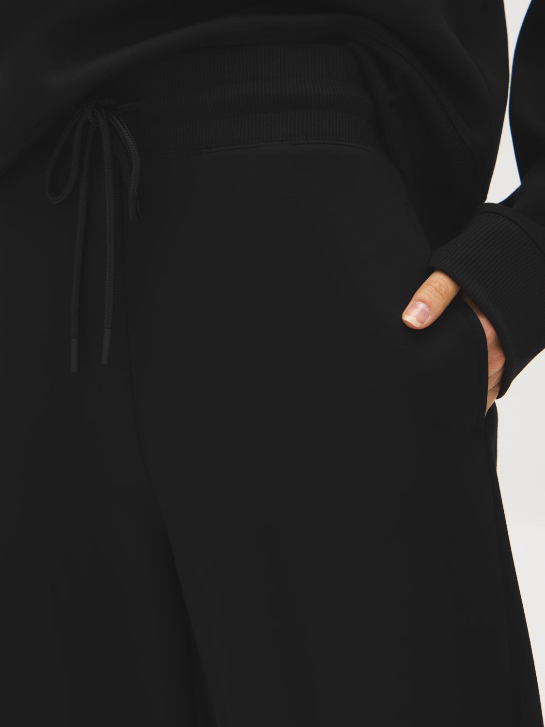 Black Cloud Fleece Wide-Leg Pant - Woman Wearing Relaxed Fit Knit Pants - Suzy Shier