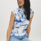 Snow White Printed Mesh Mock Neck Top - Woman Wearing Sleeveless Mesh Top with Ruching - Suzy Shier