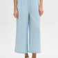 Light Wash Stripe Denim Tencel Gaucho Pant - Woman Wearing Wide-Leg Pants with Smocked Waistband - Suzy Shier