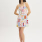 Snow White Conversational Print Halter Mini Dress - Woman Wearing Printed Linen Blend Dress - Suzy Shier