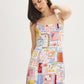 Snow White Conversational Print Halter Mini Dress - Woman Wearing Printed Linen Blend Dress - Suzy Shier