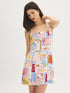 Snow White Conversational Print Halter Mini Dress - Woman Wearing Printed Linen Blend Dress - Suzy Shier