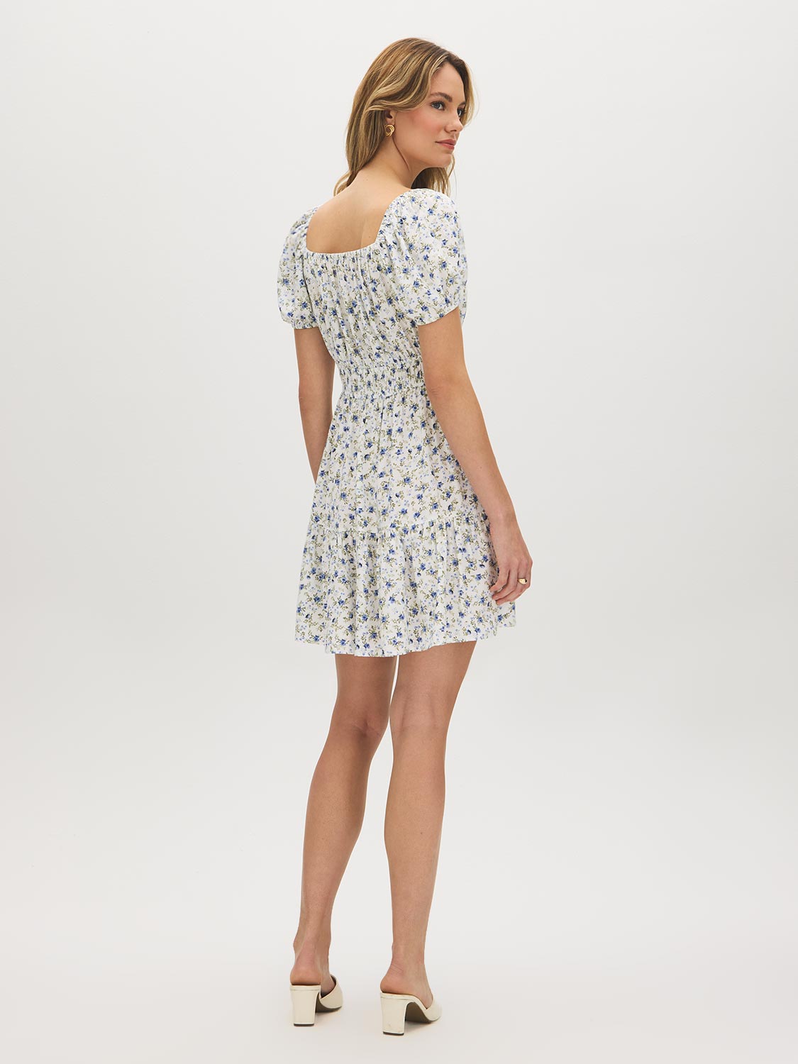 Snow White Ditsy Print Mini Dress - Woman Wearing Off-the-Shoulder Tiered Dress - Suzy Shier