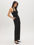 Black Halter Neck Knit Jumpsuit - Woman Wearing Elegant One-Piece with Self-Belt - Suzy Shier