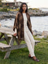 Brown Plaid Fringe Cape - Woman Wearing Oversized Woven Cape - Suzy Shier