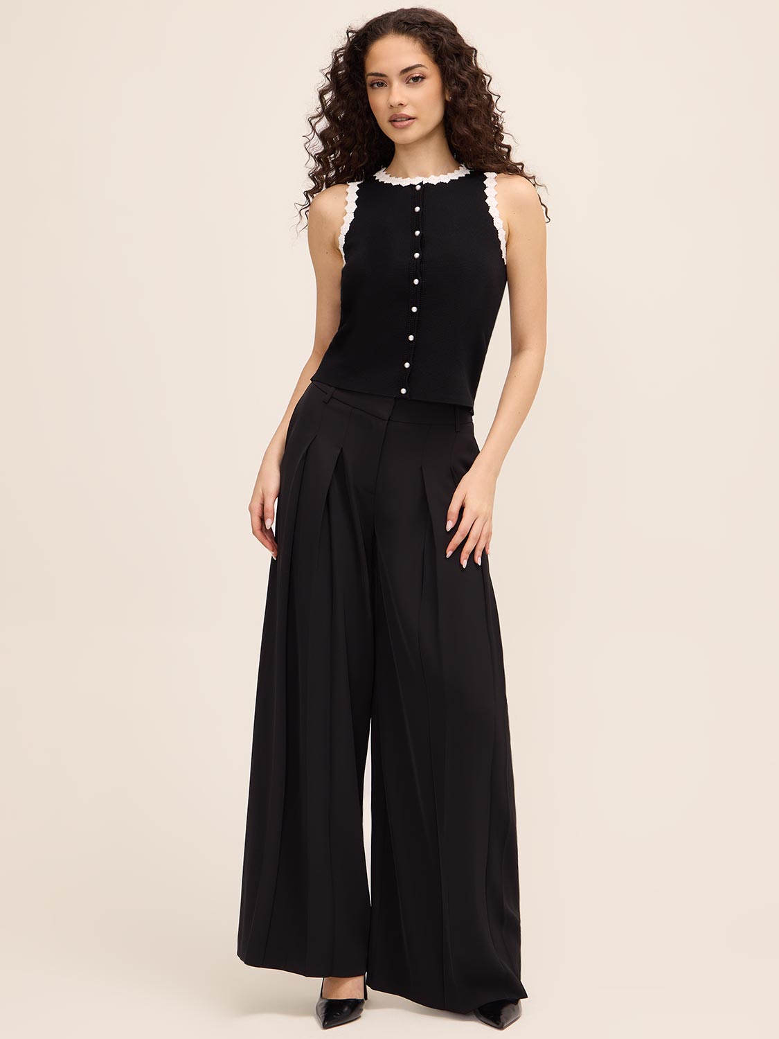 Button-Up Sweater Vest by Le Chateau.