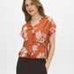 Autumn Leaf Printed V-Neck Blouse with Dolman Sleeves - Woman Wearing Relaxed Fit Blouse - Suzy Shier