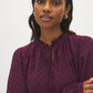 Winetasting Swiss Dot Peplum Blouse with Ruffle Neck - Close-up Fabric Detail - Suzy Shier