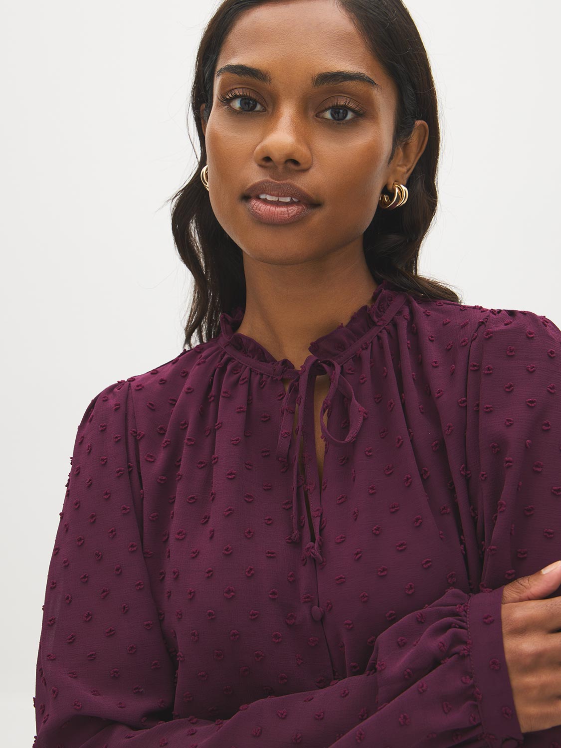 Winetasting Swiss Dot Peplum Blouse with Ruffle Neck - Close-up Fabric Detail - Suzy Shier