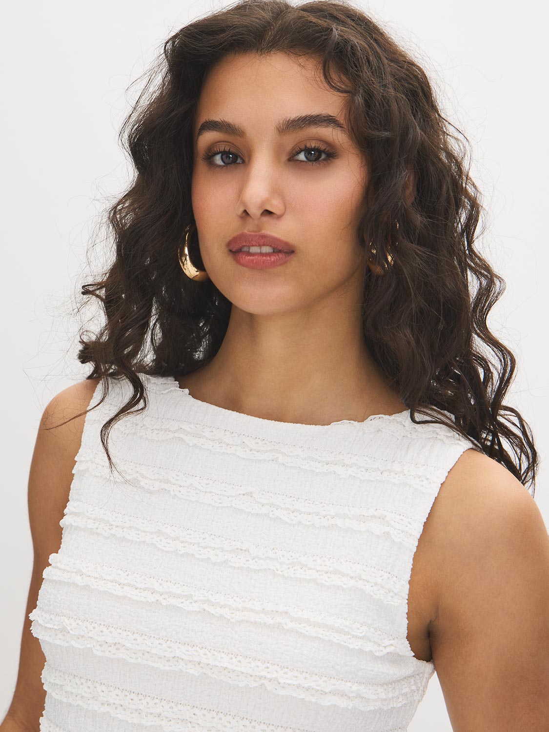 Snow White Textured Knit Peplum Top - Woman Wearing Sleeveless Boat Neck Blouse - Suzy Shier