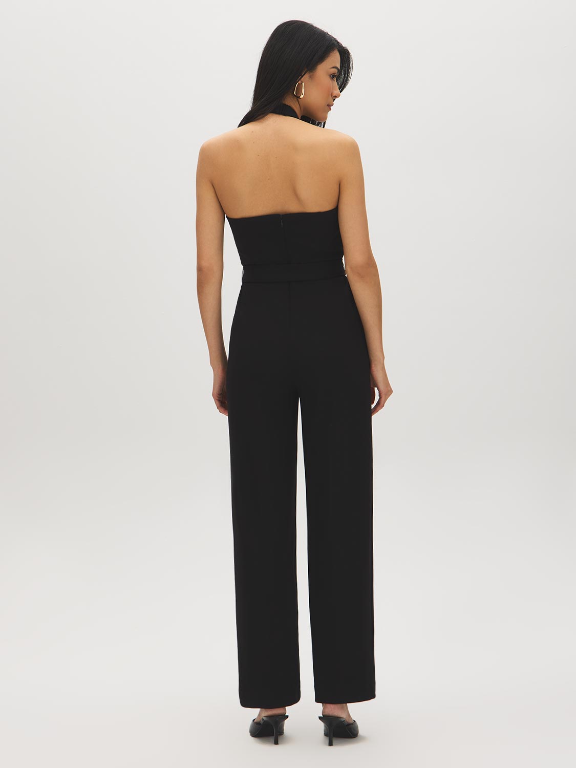 Black Halter Neck Knit Jumpsuit - Woman Wearing Elegant One-Piece with Self-Belt - Suzy Shier