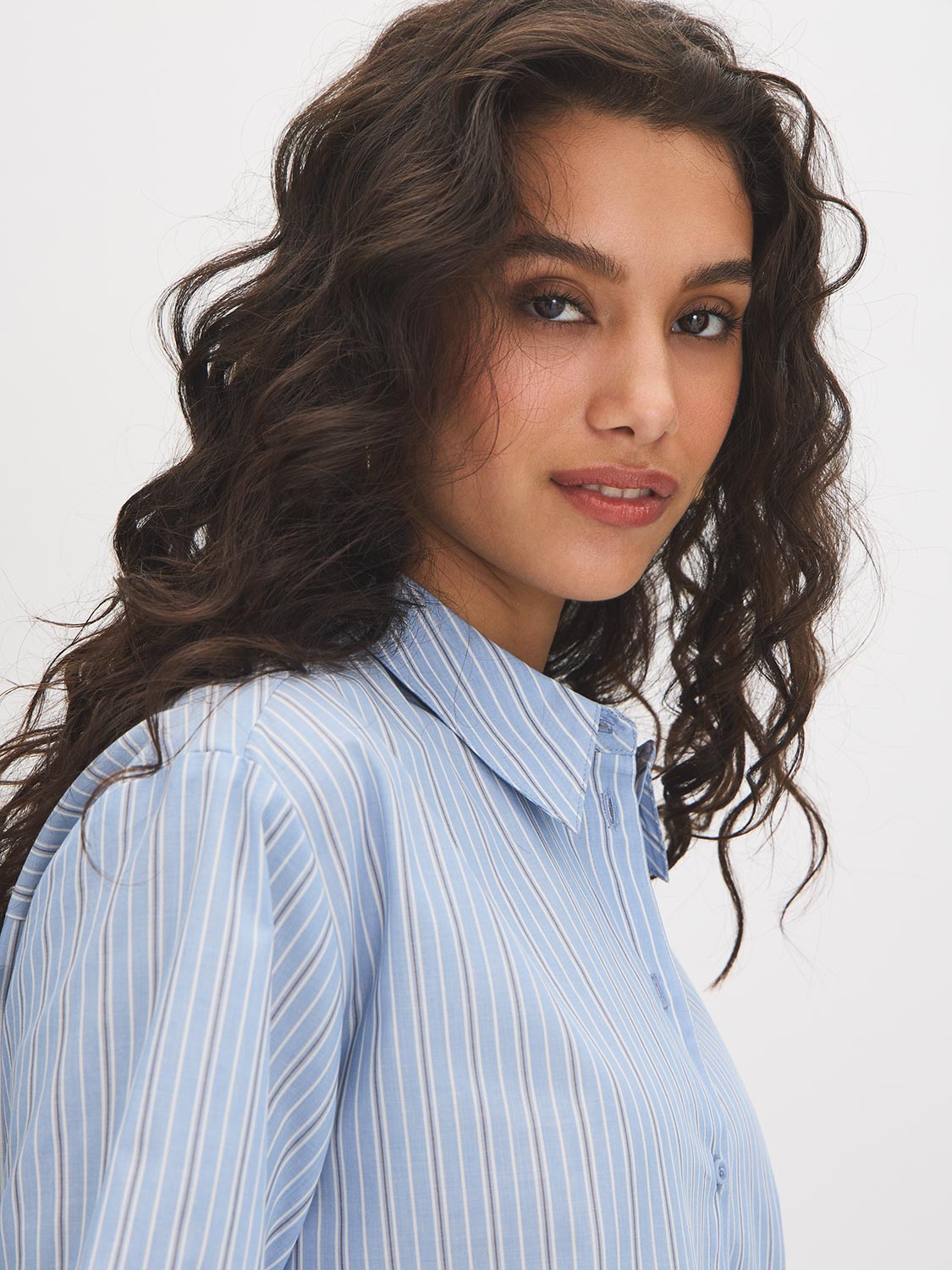 Forever Blue Striped Drop Shoulder Blouse - Woman Wearing Button-Front Shirt with Roll-Up Sleeves - Suzy Shier