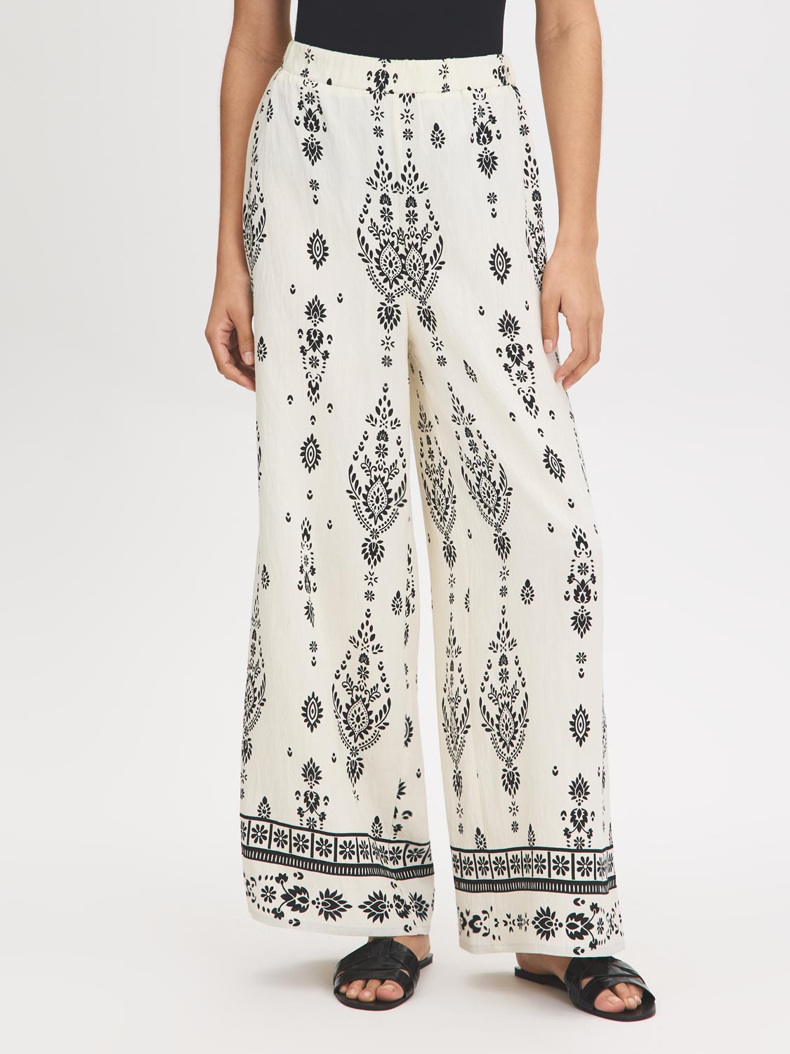 White Wide-Leg Viscose Pants with Black Border Print - Woman Wearing Casual Pull-On Pants - Suzy Shier