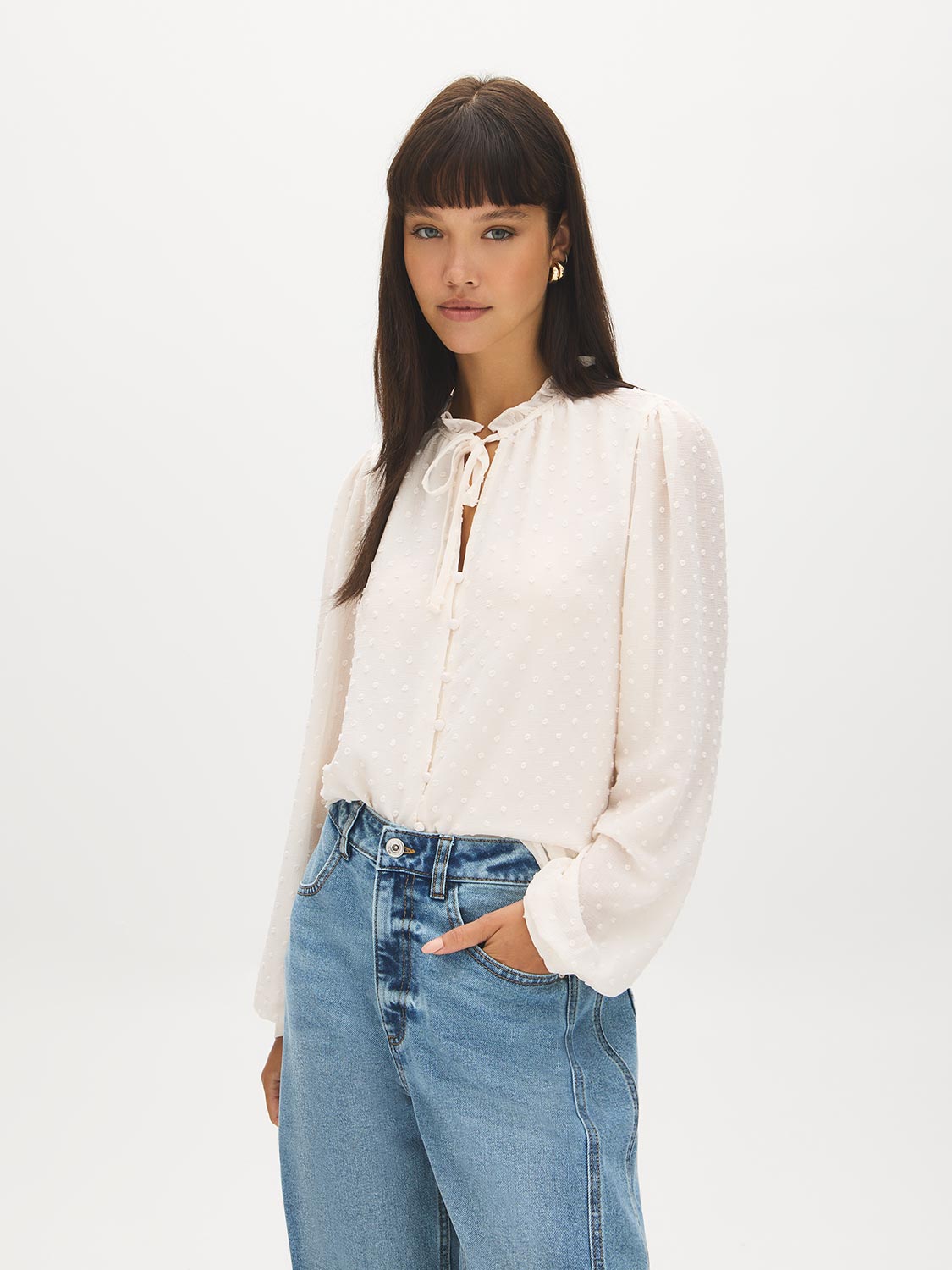 Winter White Swiss Dot Blouse with Peplum Hem - Woman Wearing Ruffle Tie Neck Blouse - Suzy Shier