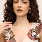 Antique Cream/Rust Printed Chiffon Crossover Neckline Gown - Woman Wearing Full-Length Ruffle Dress - Le Chateau