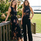Jet Black Floral Pleated Sleeveless Dress - Woman Wearing Belted Midi Dress - Suzy Shier