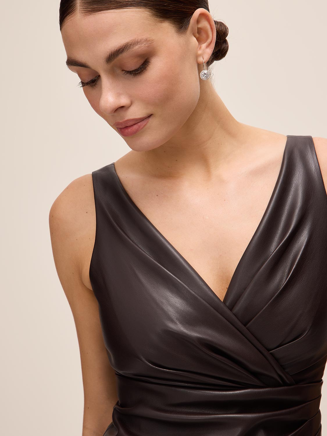 Espresso Crossover Pleated Faux Leather Dress - Close-up Fabric Detail - Le Chateau