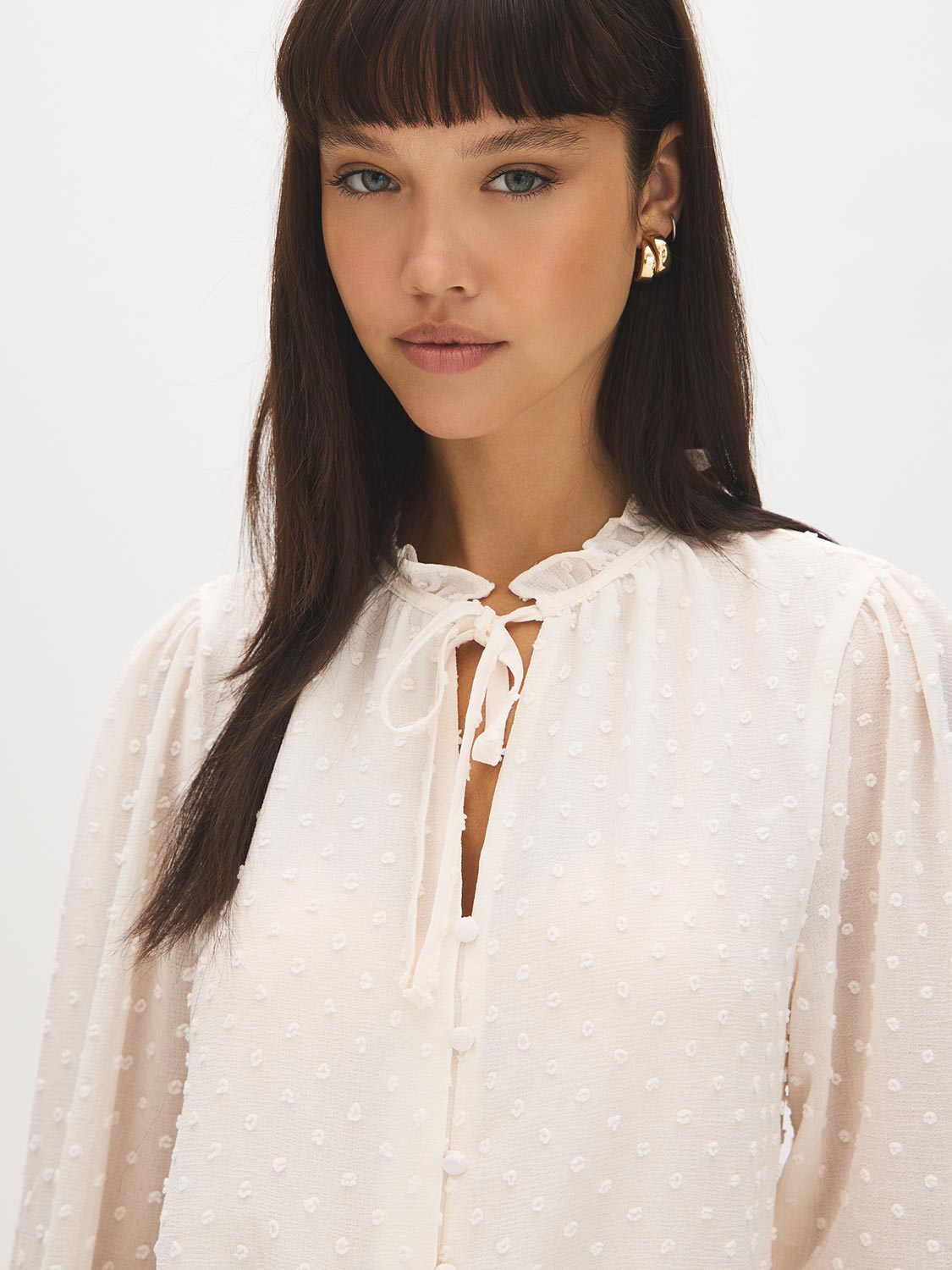 Winter White Swiss Dot Blouse with Peplum Hem - Close-up Fabric Detail - Suzy Shier