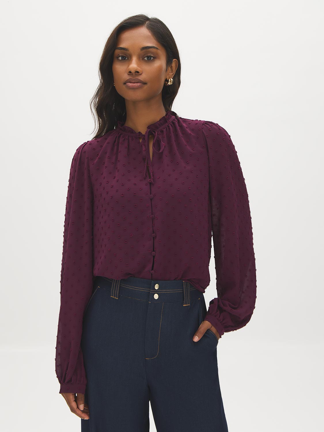 Winetasting Swiss Dot Peplum Blouse with Ruffle Neck - Woman Wearing Textured Blouse with Self-Tie - Suzy Shier
