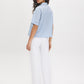 Forever Blue Striped Drop Shoulder Blouse - Woman Wearing Button-Front Shirt with Roll-Up Sleeves - Suzy Shier