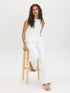 Snow White Textured Knit Peplum Top - Woman Wearing Sleeveless Boat Neck Blouse - Suzy Shier