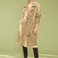 Belted trench coat in khaki grey with double-breasted closure and notch collar by Suzy.
