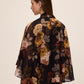 Dijon Print Floral Tie Neck Cape Top - Back View - Le Chateau