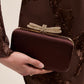 Brown/Gold Woven Satin Minaudire with Jeweled Bow - Front View - Le Chateau