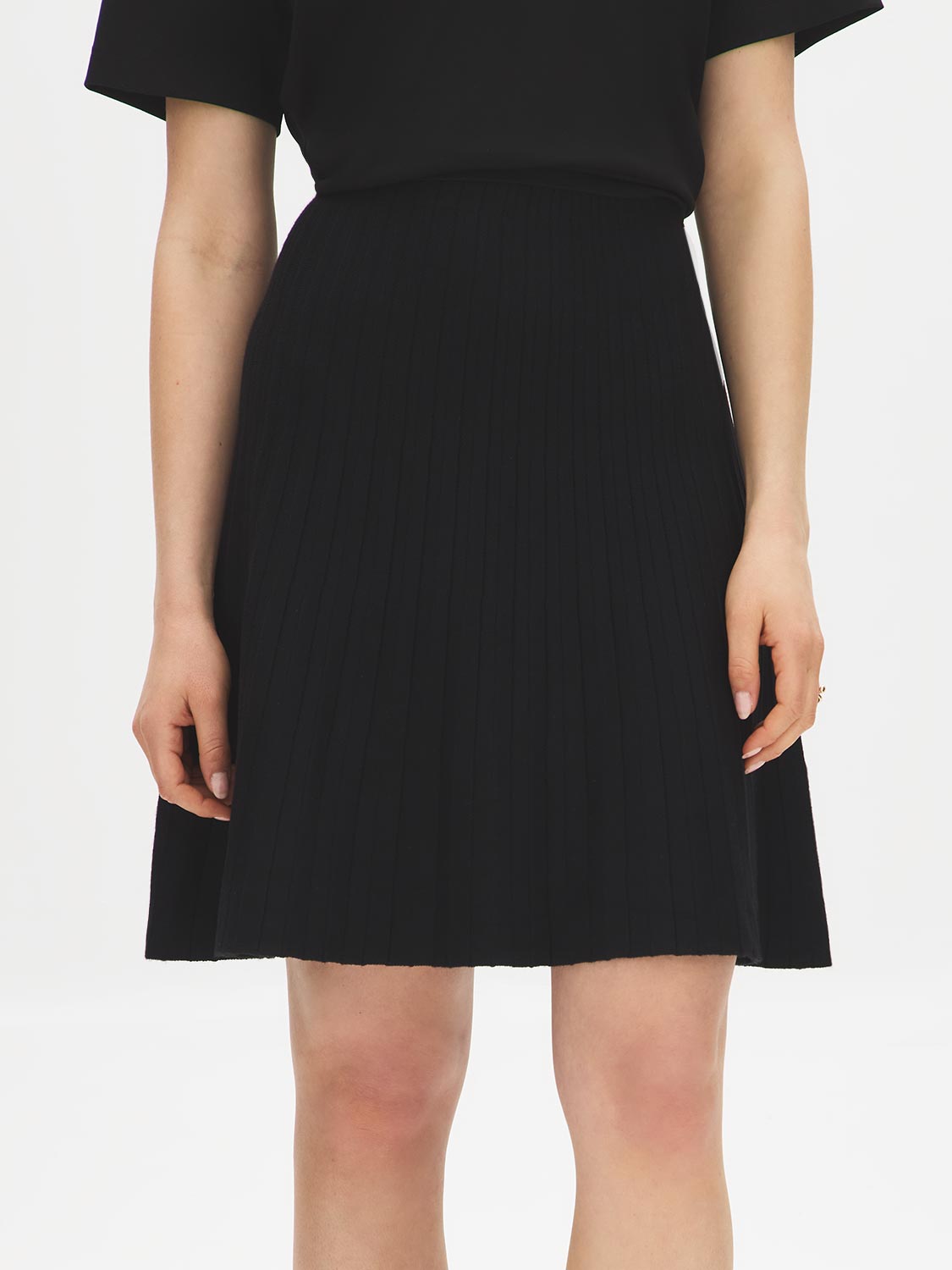 Black Pleated Sweater Knit Flippy Mini Skirt - Front View - Suzy Shier