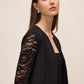 Black Knit Crepe Bolero with Illusion Lace Sleeves - Side Profile View - Le Chateau