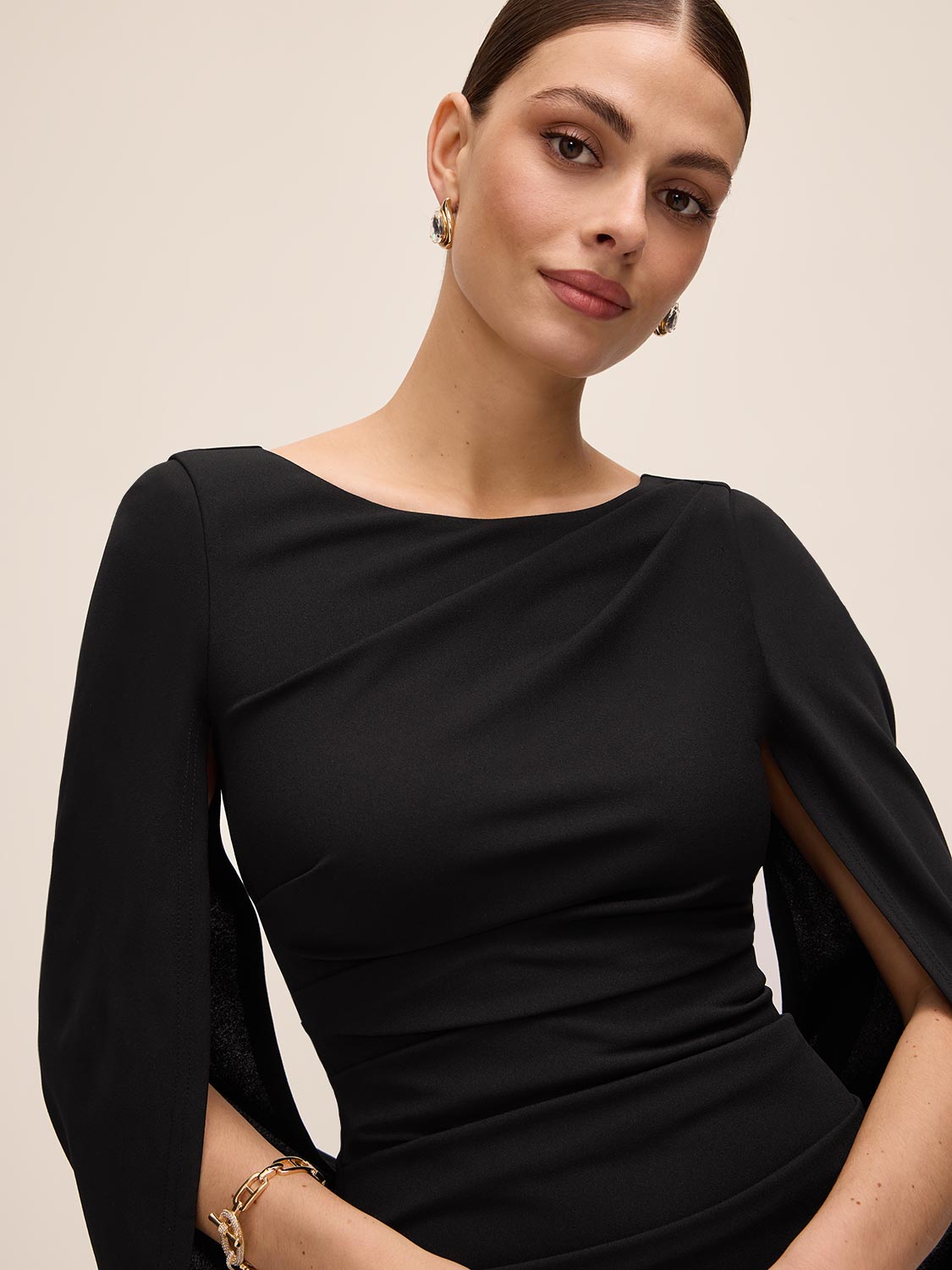Black Boat Neck Sheath Dress with Back Cape - Upper Body Detail - Le Chateau