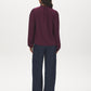 Winetasting Swiss Dot Peplum Blouse with Ruffle Neck - Back View - Suzy Shier