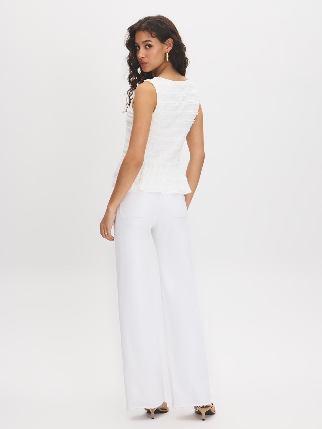 Snow White Textured Knit Peplum Top - Woman Wearing Sleeveless Boat Neck Blouse - Suzy Shier