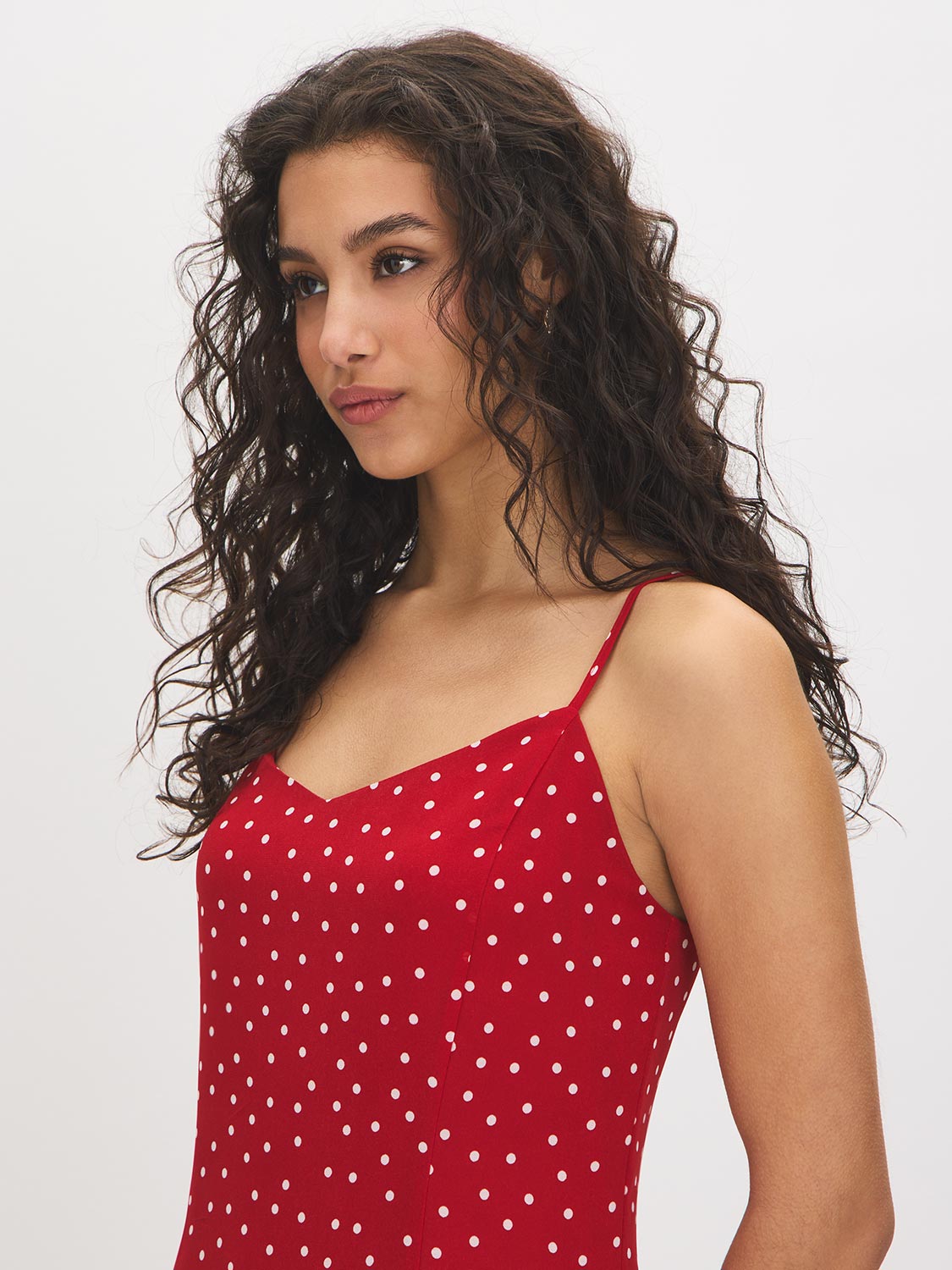 Jester Red Polka Dot Chiffon Mini Dress - Woman Wearing V-Neck Mini Dress with Adjustable Straps - Suzy Shier