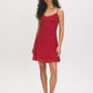 Jester Red Polka Dot Chiffon Mini Dress - Woman Wearing V-Neck Mini Dress with Adjustable Straps - Suzy Shier
